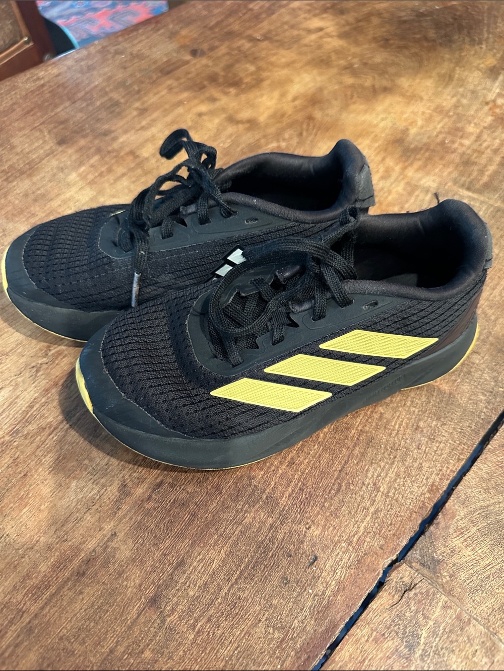 adidas Kids Black Sneakers with Yellow Stripes